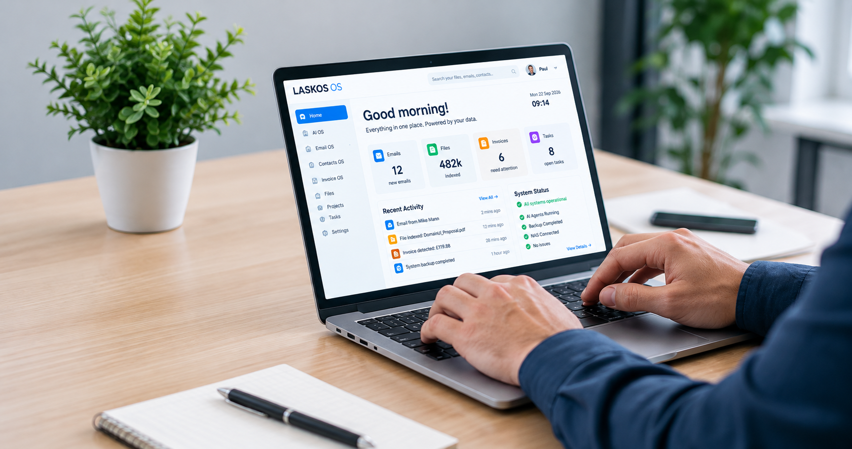 Business owner working in the Laskos OS dashboard on a laptop